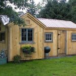 8x18 Heritage post and beam shed with extra windows and a brown metal roof