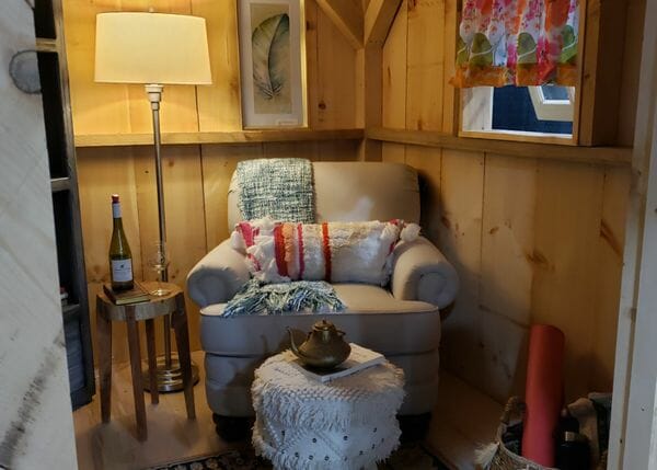 Cozy interior of our a decorated cabin used as a reading nook.