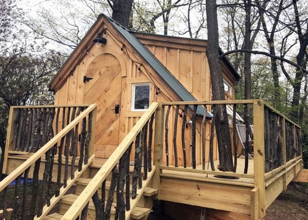 10x16 Smithaven whimsical cottage with arched door and dormer full of windows