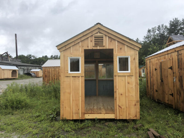 Two 16" x 21" insulated windows are installed on either side of the door opening on this shed  build.