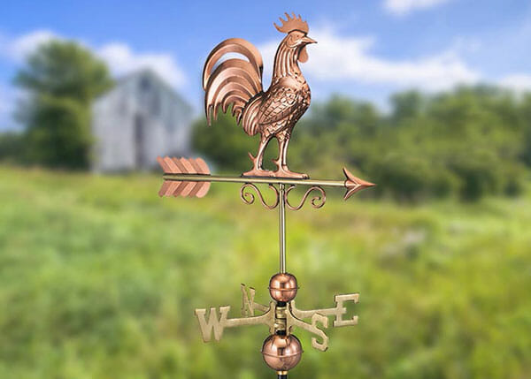 This decorative weathervane is made out of copper with brass directionals.