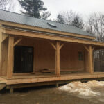Porch kit for addition of covered porch using 8x8 Post & Beam construction.