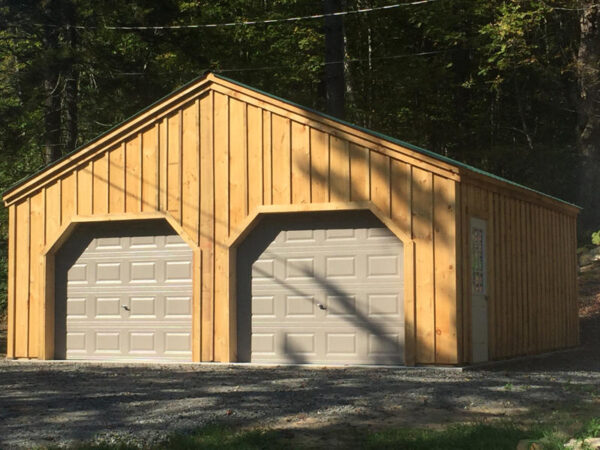 9x7 Overhead Garage Doors installed on 24x24 Simple Garage.