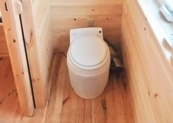 Laveo Dry Flush Toilet installed in Tiny House on Wheels.  Self Contained, compact & odorless.