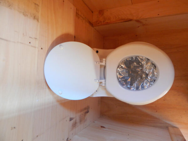 Laveo Dry Flush Toilet installed in Tiny House on Wheels.  Self Contained, compact & odorless.