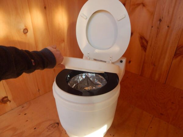 Laveo Dry Flush Toilet seat.  Self contained, compact & odorless. For use in Tiny House, cabin, camp or RV.