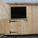4-0 JCS Built 2" thick Pine Dutch Door on 10x20 Two Stall Barn.  Exterior view. Black Drop Latch and Strap Hinges.