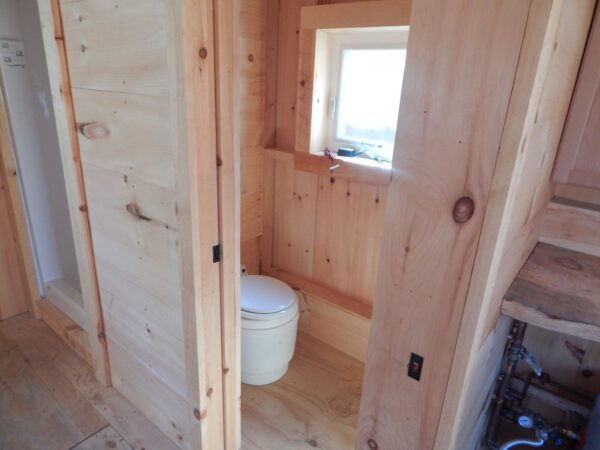 Dry flush toilet for a cabin
