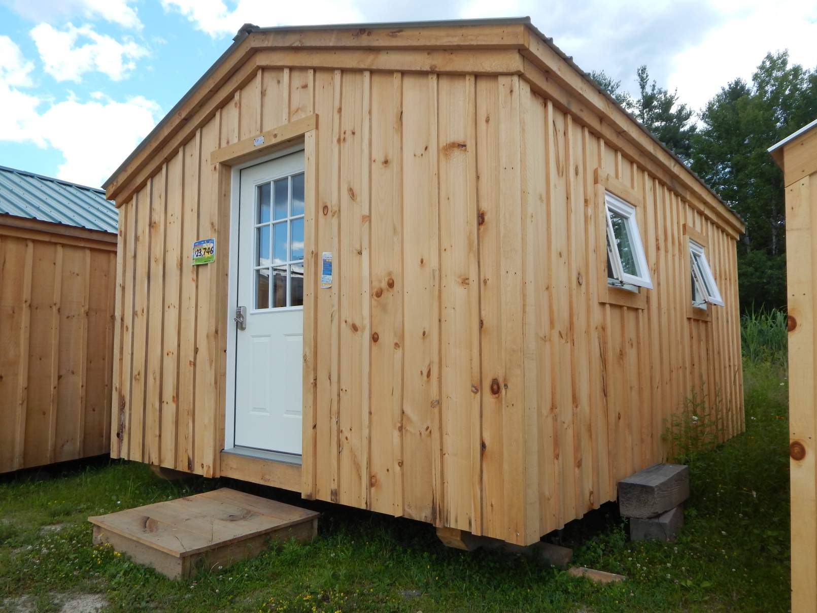 Small cabin with an insulated door and two awning windows