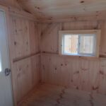 Sliding insulated windows installed inside a tiny cabin