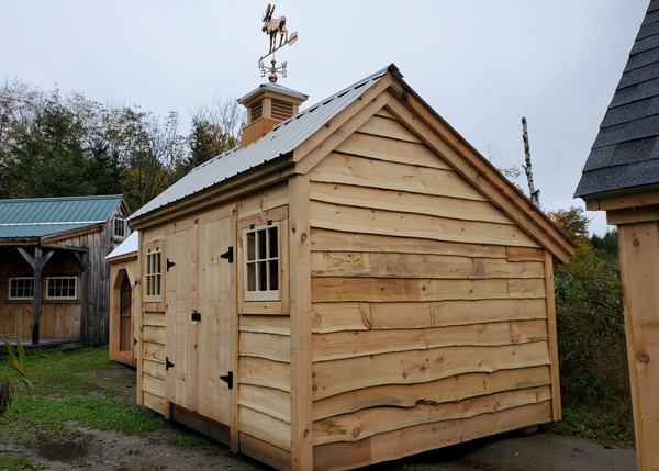 10x12 Saltbox storage shed with a moose weathervane.