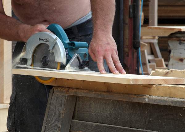 Employee working with a circular saw