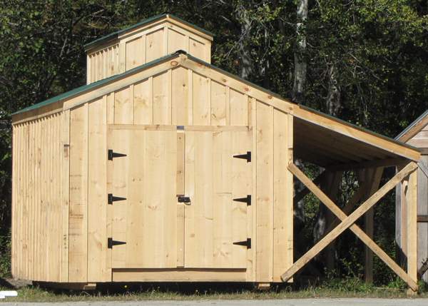 Shed with a decorative cupola and lean-to overhang
