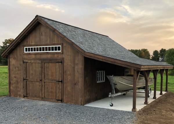 384 square foot garage with an overhang used to store a small motor boat.