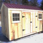 6x12 Economy Nantucket with barn-sash windows and a red corrugated metal roof