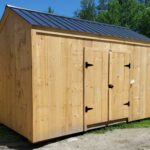 8x14 New Yorker Prefab Storage Shed with a black metal roof