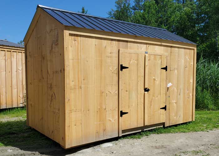 8x14 New Yorker Prefab Storage Shed with a black metal roof