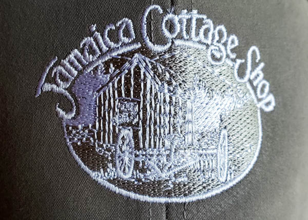Embroidered Jamaica Cottage Shop logo.