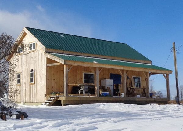 This 20x40 Cabin is shown with a covered porch add on. Additional modifications were made by the client.