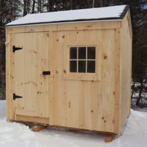 Small storage shed with a barn window