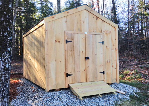 10x14 New Yorker Option B backyard shed with a set of double doors and a pressure treated ramp