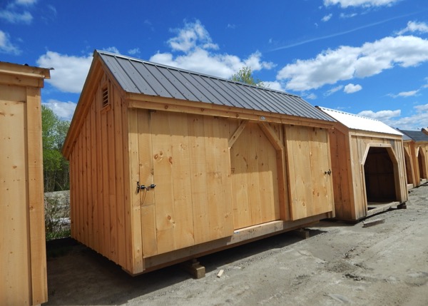 Three door storage shed for motorcycles, snowmobiles and atv storage.