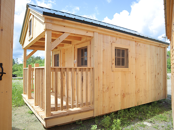 Premium trim package, railing, and extra barn sash windows with screens are a few of the upgrades shown on this Bunkhouse.