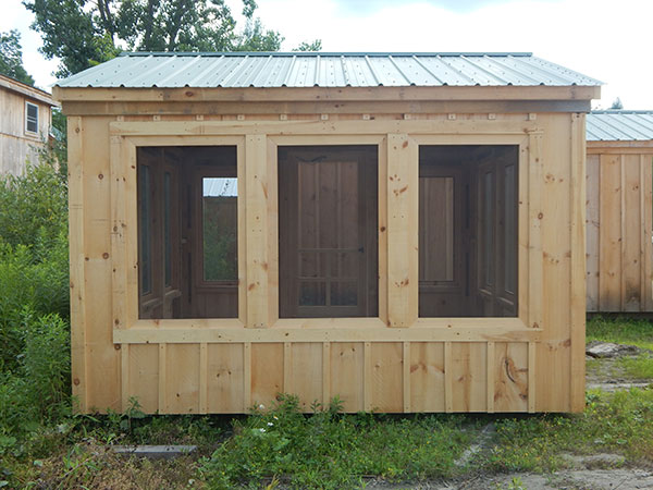 12x12 Florida Room with pine board and batten siding and an evergreen corrugated metal roof.