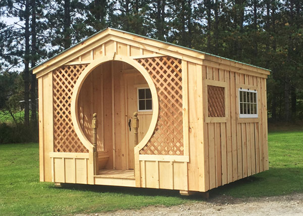 12x12 Love Nest with unique keyhole porch entry, built in benches, hinged windows and pine board and batten siding.