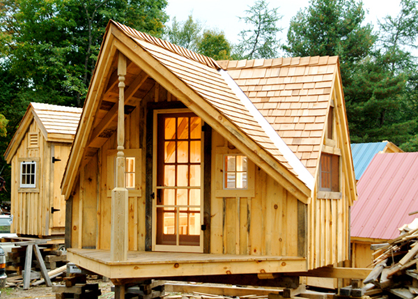 12x14 Writers Haven with a cedar shingle roof and 15-lite wooden door