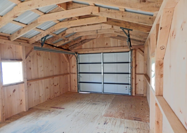 14x20 Barn Garage interior with overhead garage door and an addition of a hilnged window