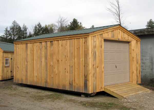 14x20 Barn Garage with evergreen metal roof, overhead door and pressure treated ramp.