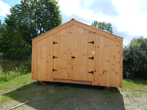 14x20 Economy Barn fitted with pine board siding and corrugated metal roofing.