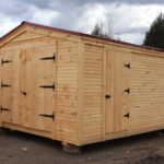 custom built barn with horizontal pine clapboard siding.