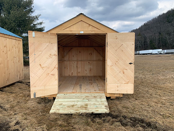 The 8x12 Economy Vermonter includes a set of pine double doors and a treated ramp.