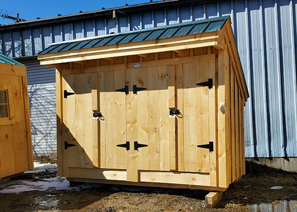 The 4x12 Garbage Shed comes with pine board siding, an evergreen metal roof and two sets of double doors. Battens were added to the siding on this model.