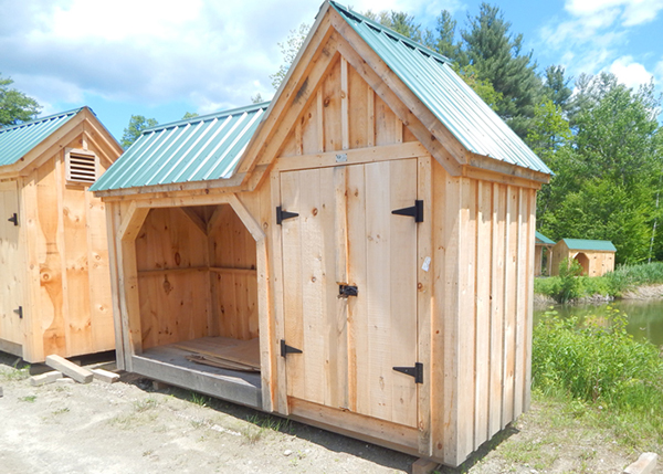 4x14 Vermont Gem storage shed built with pine siding and a green metal roof.