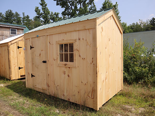 This tiny shed could be used as a playhouse or for storing garden tools. This economy shed was upgraded to have an evergreen metal roof.