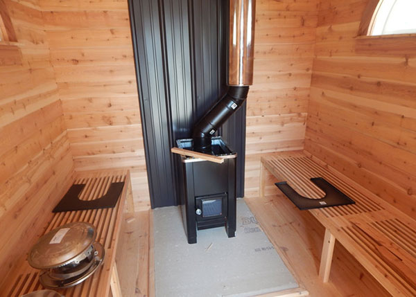 This 4-Season Gable shed was modified to be a sauna. Inside we sheathed the walls with cedar, added cedar benches, a heat shield, and woodstove. If you are interested in a sauna call our sales team for a quote.