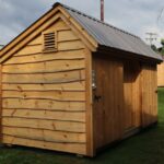 This custom bicycle shed was customized to have adirondack live edge siding and it looks great.