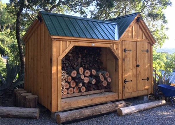 8x14 Vermont Gem with a Hartford Green metal roof, and pine board and batten siding. The siding was stained on this prefab shed.