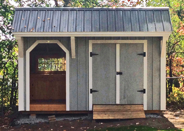 8x14 Weston Potting Shed with Charcoal Gray metal roof, painted gray with white trim.