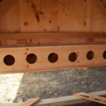 Interior of an 8x8 chicken coop with nesting boxes.