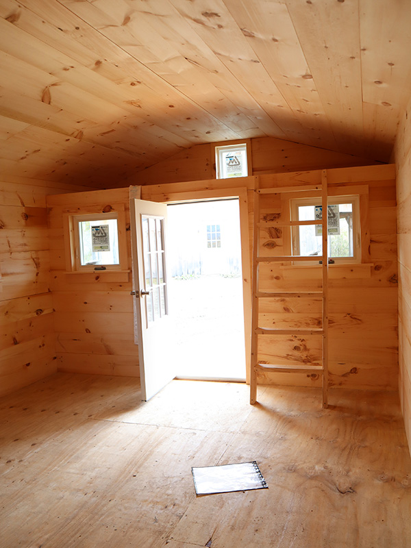 A small loft is installed over the porch. This can be used for storage or a sleeping area for a child.
