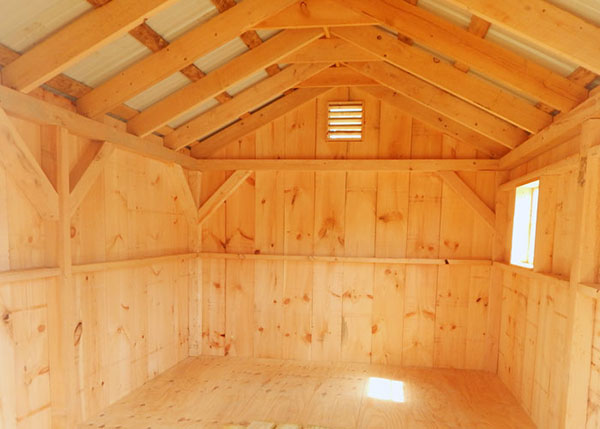 10x14 Gable Shed interior with hemlock framing, pine siding and a 3/4" CDX plywood decking. Sheds also include a wood louvered vent for airflow.