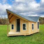 This tiny four season one room cottage can be used as a detached office in your backyard.