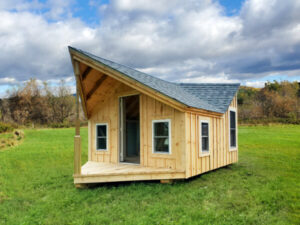This tiny four season one room cottage can be used as a detached office in your backyard.