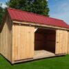 Three bay storage shed for snowmobiles, with a red metal roof.