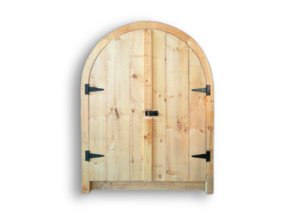 Arched double doors made from pine that are designed to fit in sheds and garages.