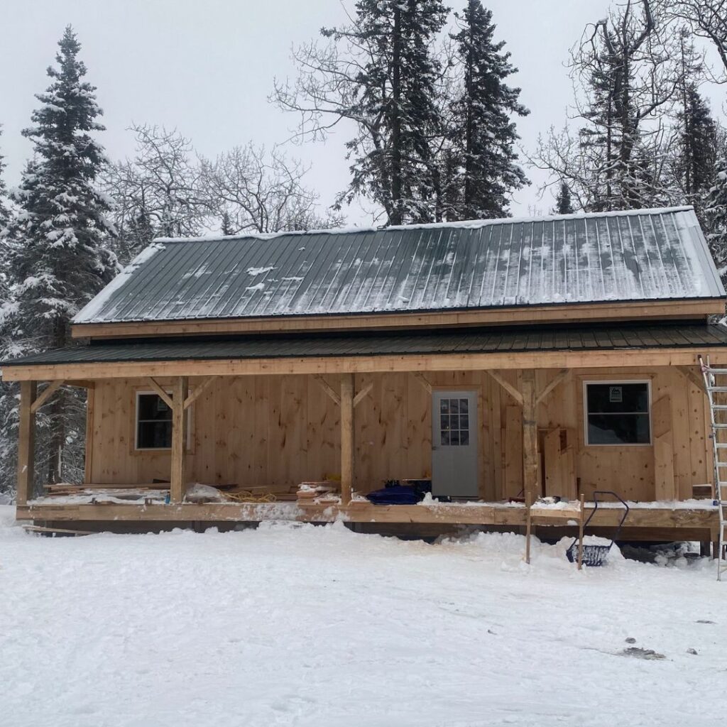 This 20x40 Vermont Cabin is nearly finished being built in the winter, and looks beautiful against the snowy landscape.
